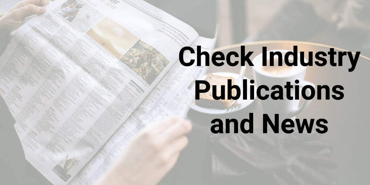 person reading a newspaper with the text "check industry publications and news"